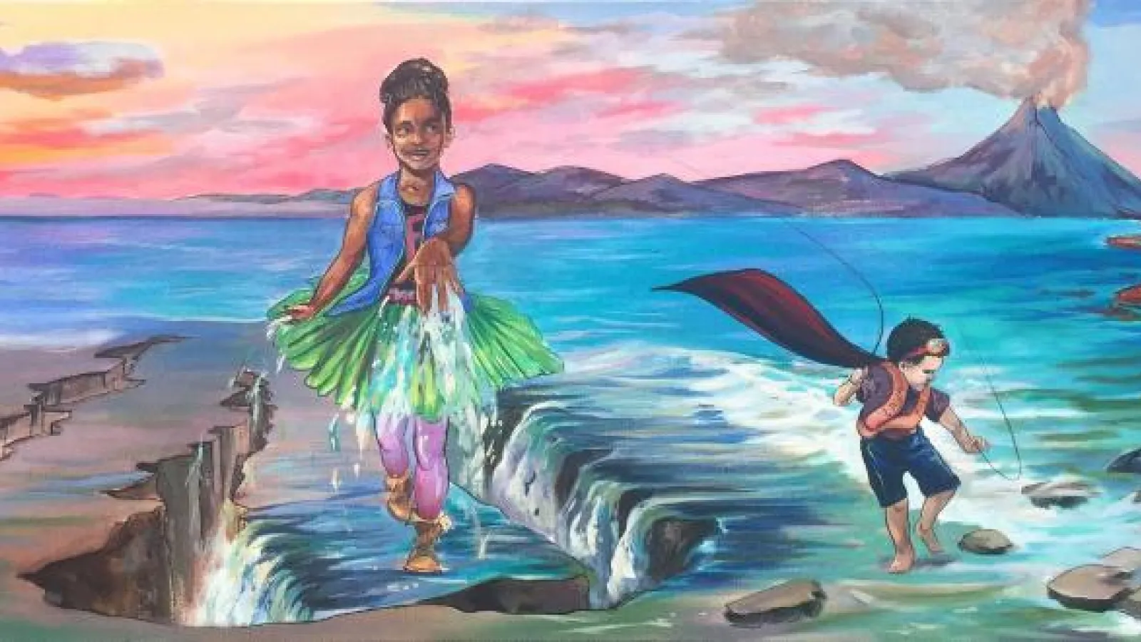Mural of two young costumed figures playing in the ocean with a volcano in the background
